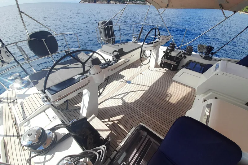  Yacht Photos Pics Luxurious 2015 Jeanneau Yachts 64 deck with dual steering wheels and ocean view.