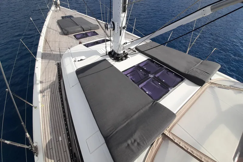  Yacht Photos Pics 2015 Jeanneau Yachts 64 deck with sunbathing cushions and ocean view.