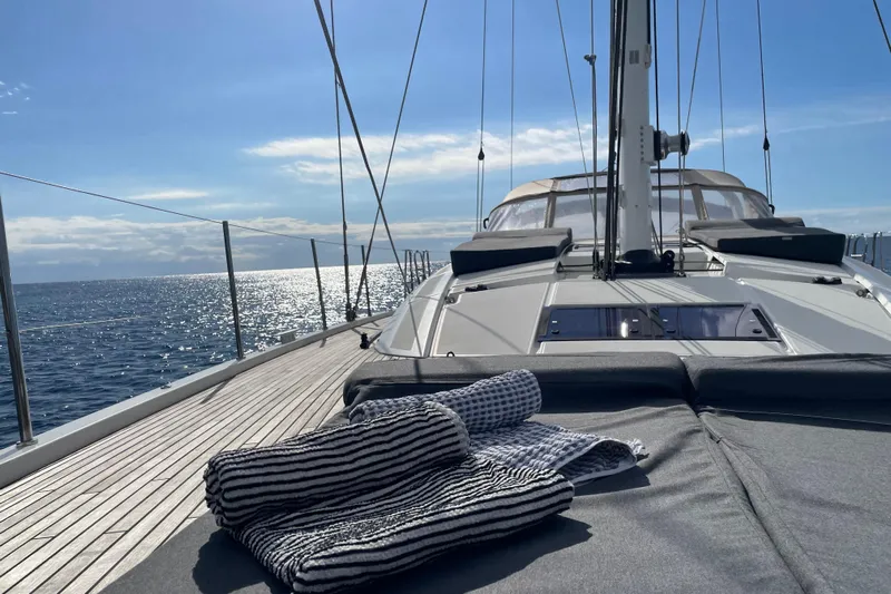  Yacht Photos Pics Luxurious 2015 Jeanneau Yachts 64 sailing on a sunny ocean day.