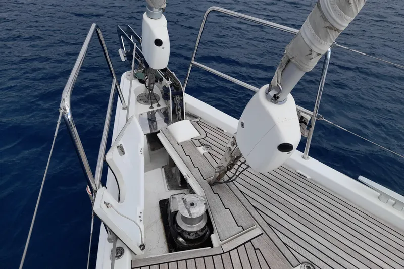  Yacht Photos Pics 2015 Jeanneau Yachts 64 deck with winch and railing, sailing on blue ocean.