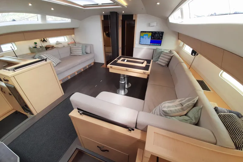  Yacht Photos Pics Luxurious interior of 2015 Jeanneau Yachts 64 with spacious seating and modern design.