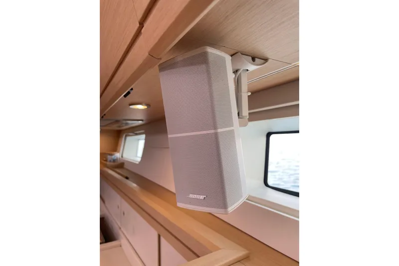  Yacht Photos Pics Speaker system inside 2015 Jeanneau Yachts 64, featuring modern interior design.