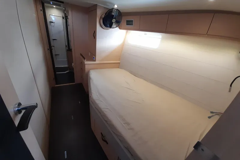  Yacht Photos Pics Interior cabin of 2015 Jeanneau Yachts 64, featuring a bed and ensuite bathroom.