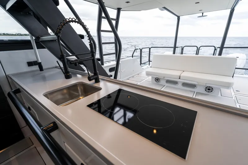  Yacht Photos Pics Modern kitchen area on 2023 Vandal 46 Explorer yacht with ocean view.
