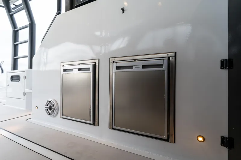  Yacht Photos Pics 2023 Vandal 46 Explorer yacht interior with stainless steel storage compartments.