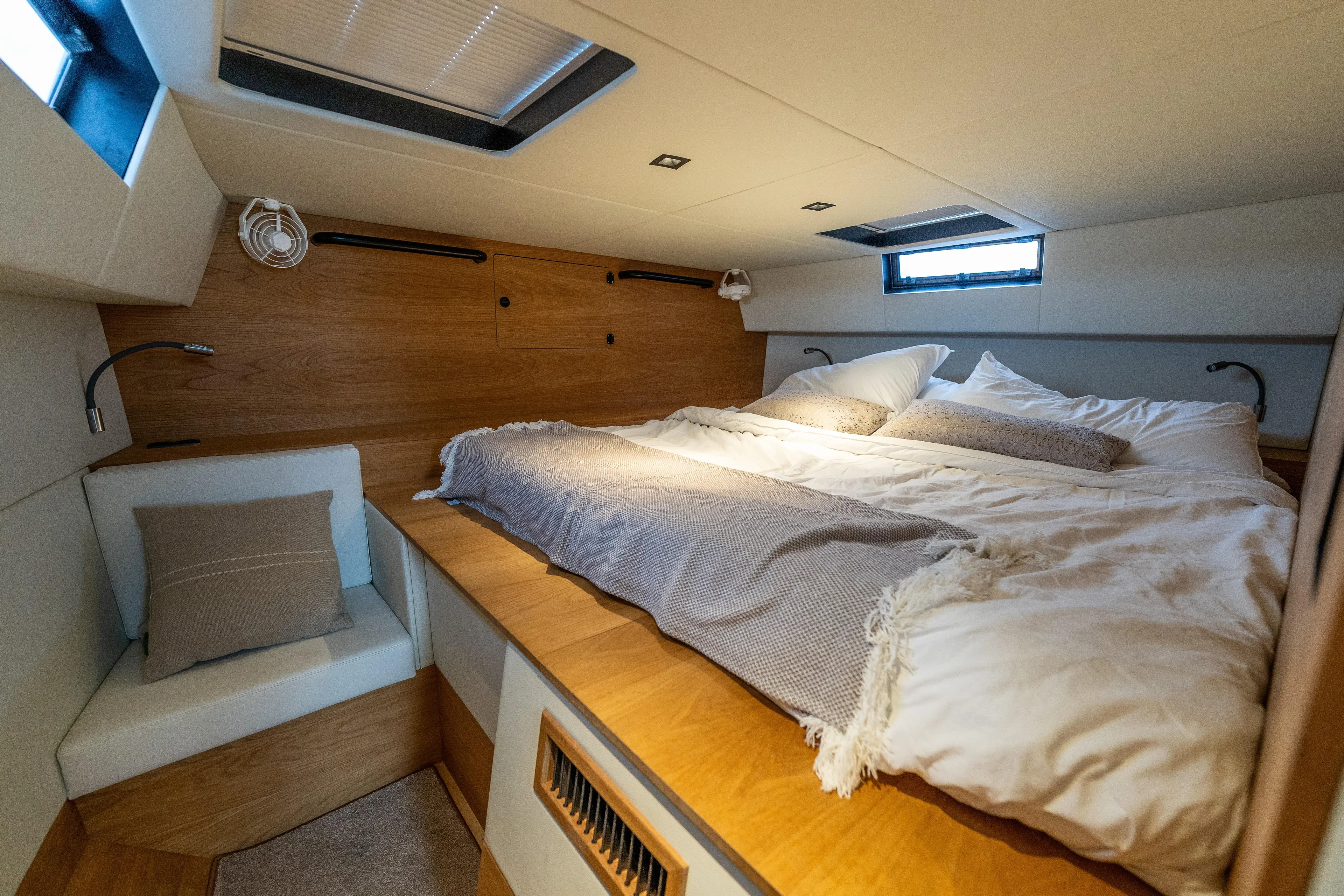  Yacht Photos Pics Luxurious cabin interior of 2023 Vandal 46 Explorer yacht with cozy bedding.