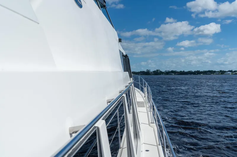 Last Call Yacht Photos Pics 2009 Pacific Mariner 65 Motoryacht cruising on a sunny day with blue skies.