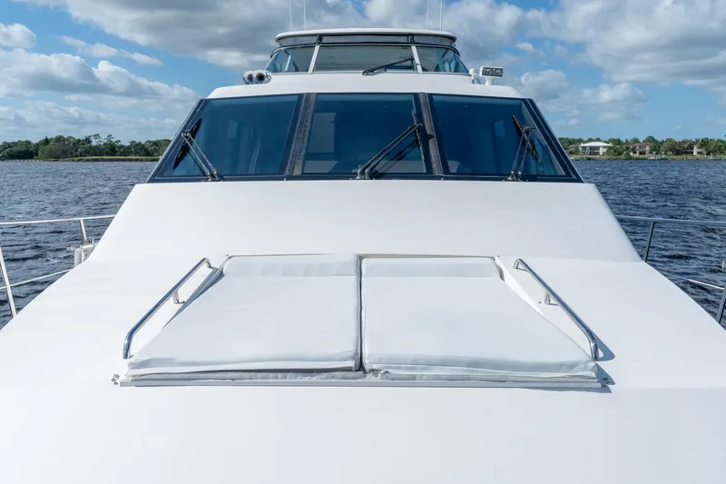 Last Call Yacht Photos Pics 2009 Pacific Mariner 65 Motoryacht on water, showcasing sleek design and spacious deck.