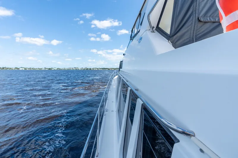 Last Call Yacht Photos Pics 2009 Pacific Mariner 65 Motoryacht cruising on a sunny day with clear blue skies.