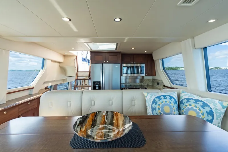 Last Call Yacht Photos Pics Luxurious interior of 2009 Pacific Mariner 65 Motoryacht with modern kitchen and elegant decor.
