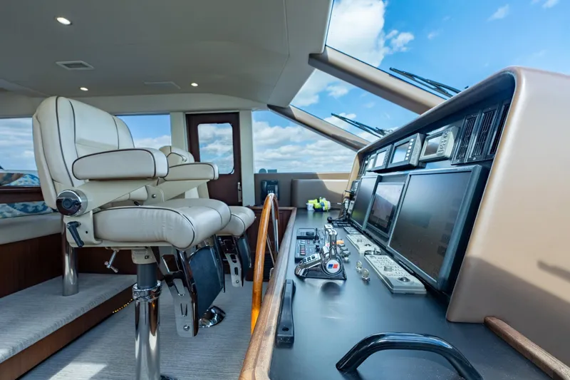 Last Call Yacht Photos Pics Luxurious helm of 2009 Pacific Mariner 65 Motoryacht with modern navigation equipment.