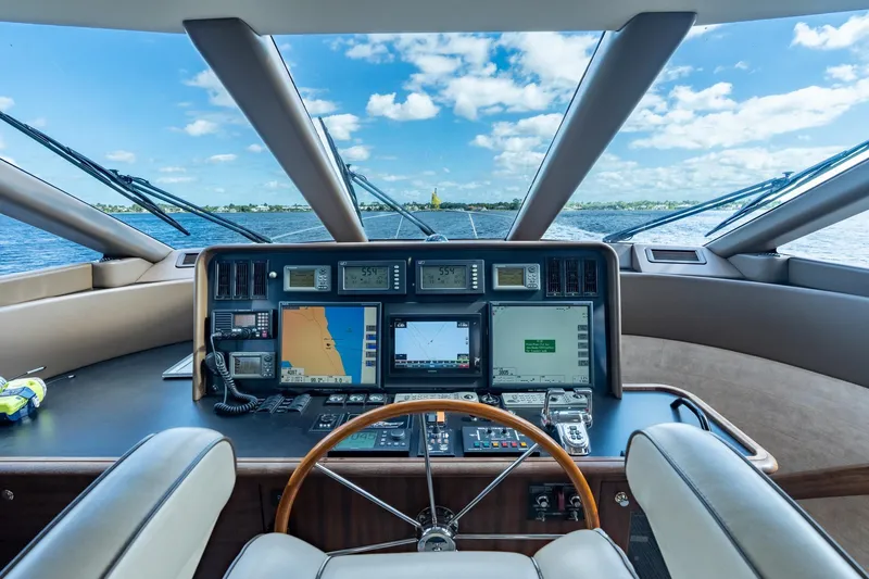 Last Call Yacht Photos Pics 2009 Pacific Mariner 65 Motoryacht helm with navigation screens and ocean view.