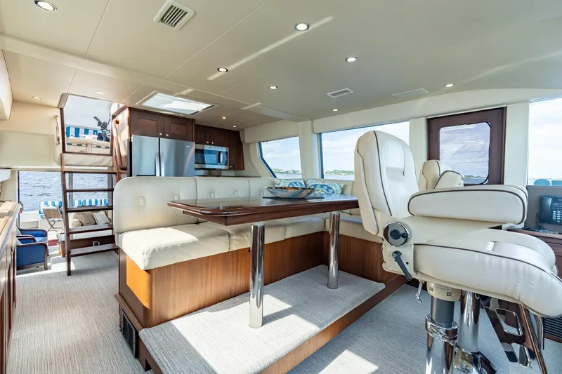 Last Call Yacht Photos Pics Luxurious interior of 2009 Pacific Mariner 65 Motoryacht with elegant seating and modern amenities.