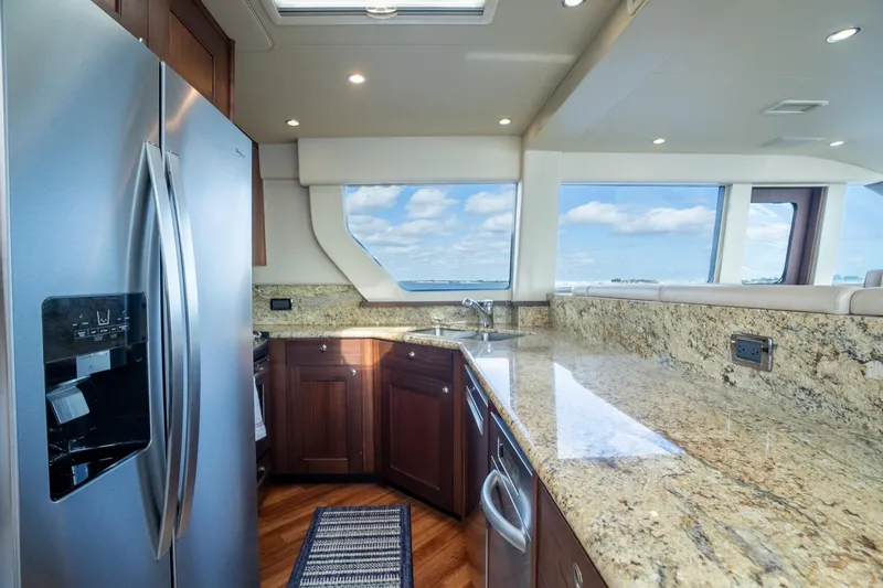 Last Call Yacht Photos Pics Luxurious kitchen interior of 2009 Pacific Mariner 65 Motoryacht with granite countertops.
