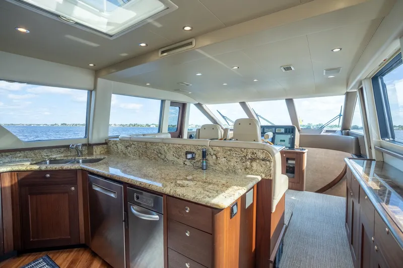 Last Call Yacht Photos Pics Luxurious interior of 2009 Pacific Mariner 65 Motoryacht with granite countertops and panoramic windows.
