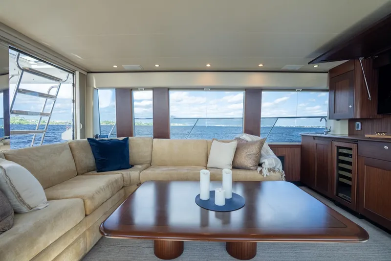 Last Call Yacht Photos Pics Luxurious interior of 2009 Pacific Mariner 65 Motoryacht with elegant seating and ocean view.