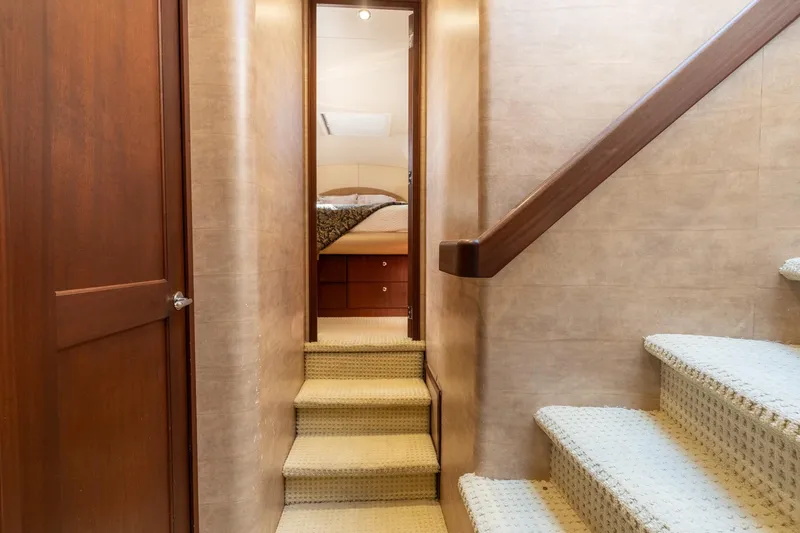 Last Call Yacht Photos Pics Interior hallway of 2009 Pacific Mariner 65 Motoryacht with stairs leading to bedroom.