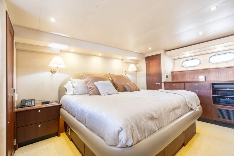 Last Call Yacht Photos Pics Luxurious bedroom interior of 2009 Pacific Mariner 65 Motoryacht with elegant furnishings.