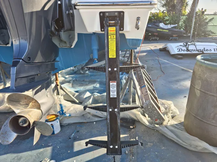  Yacht Photos Pics Pursuit 266 boat maintenance with propeller and support stand, 2020 model.