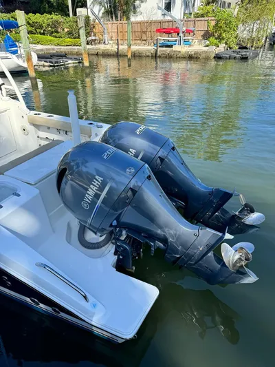  Yacht Photos Pics 2020 Pursuit 266 boat with twin Yamaha outboard motors docked in a marina.