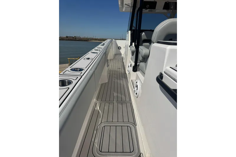 The Madd House Yacht Photos Pics 2023 Twin Vee 400 GFX CC boat deck with sleek design and modern features.