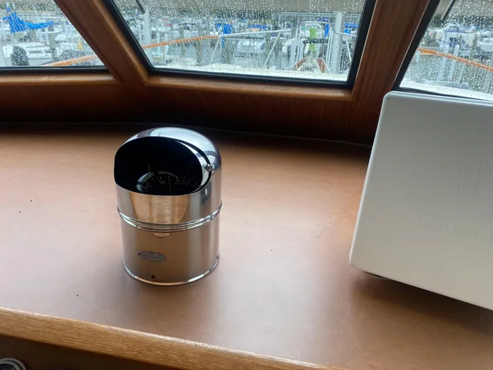  Yacht Photos Pics Interior of 1983 Hatteras 53 Motor Yacht with compass and window view.