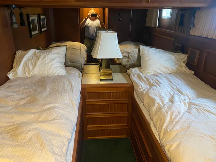 Yacht Photos Pics Interior of 1983 Hatteras 53 Motor Yacht with twin beds and wooden cabinetry.