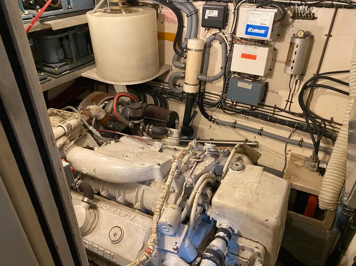  Yacht Photos Pics Engine room of 1983 Hatteras 53 Extended Deckhouse Motor Yacht, showcasing mechanical components.