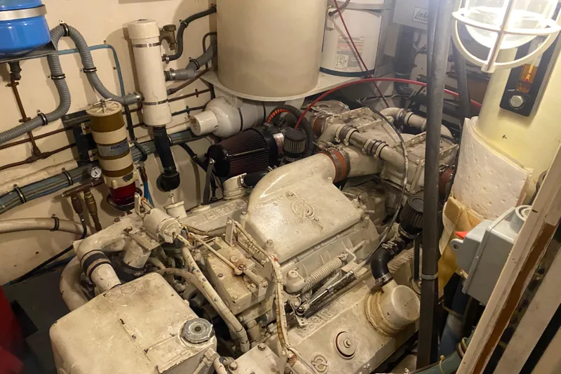  Yacht Photos Pics Engine room of 1983 Hatteras 53 Extended Deckhouse Motor Yacht, showcasing mechanical components.