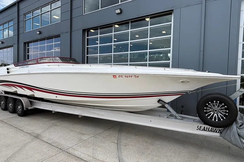  Yacht Photos Pics 2007 Fountain 38 Lightning boat on trailer outside modern building.