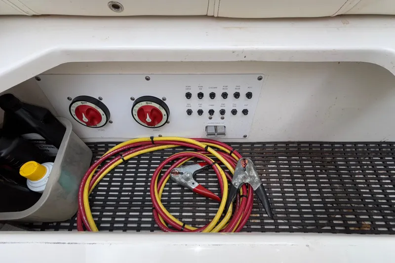  Yacht Photos Pics 2007 Fountain 38 Lightning boat battery compartment with cables and control panel.