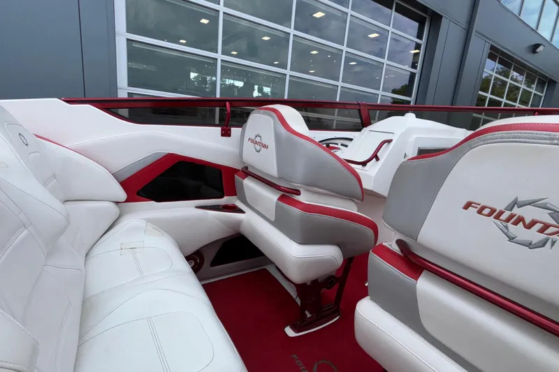  Yacht Photos Pics 2007 Fountain 38 Lightning boat interior with white and red seating, showcasing sleek design.