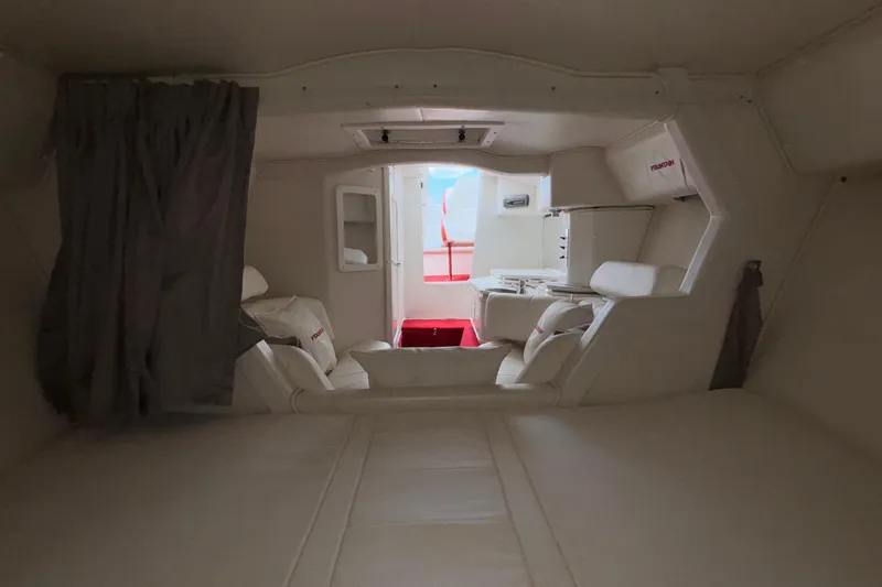  Yacht Photos Pics Interior of 2007 Fountain 38 Lightning boat, featuring white seating and modern design.