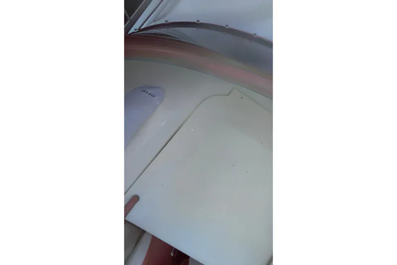  Yacht Photos Pics 2007 Fountain 38 Lightning boat interior with white flooring and a visible sock.