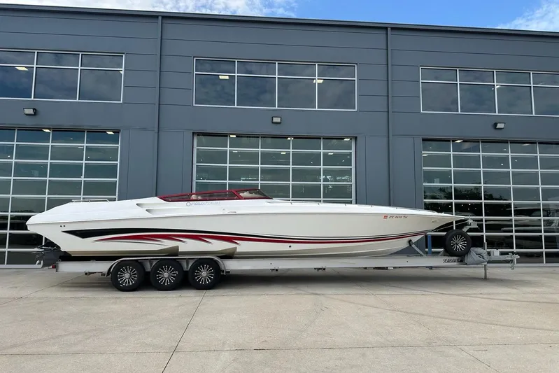  Yacht Photos Pics 2007 Fountain 38 Lightning boat on trailer, parked outside a modern building.