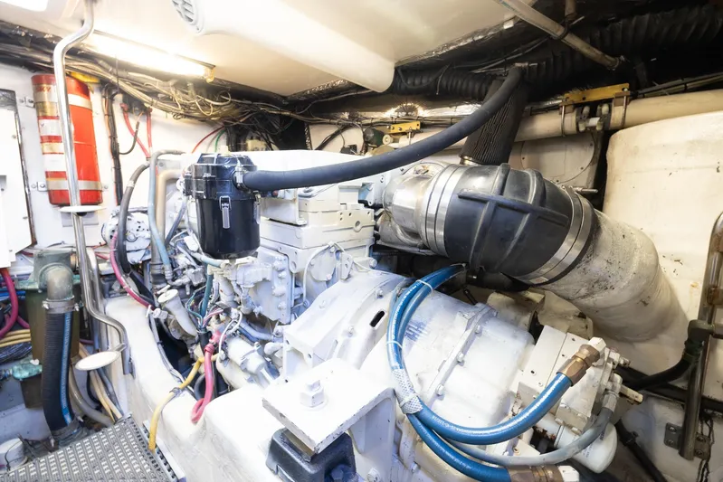 Mutiny Yacht Photos Pics Engine room of 2004 Tiara Yachts 4200 Open with cables and hoses.