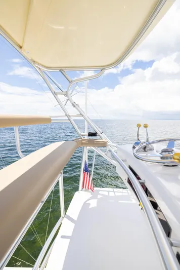 Mutiny Yacht Photos Pics Tiara Yachts 4200 Open 2004 on open sea, helm view.