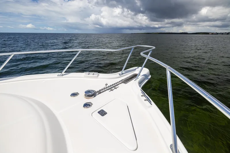 Mutiny Yacht Photos Pics Tiara Yachts 4200 Open 2004 on calm sea under cloudy sky.