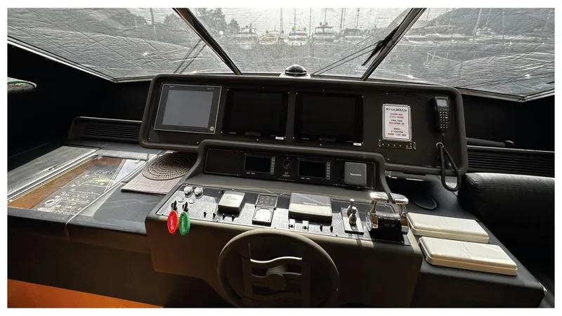  Yacht Photos Pics Control panel of 2008 Ferretti Yachts 731, featuring navigation screens and controls.