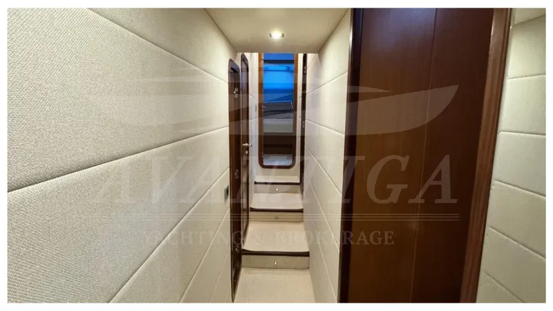  Yacht Photos Pics Hallway interior of 2008 Ferretti Yachts 731, featuring elegant wood and fabric paneling.