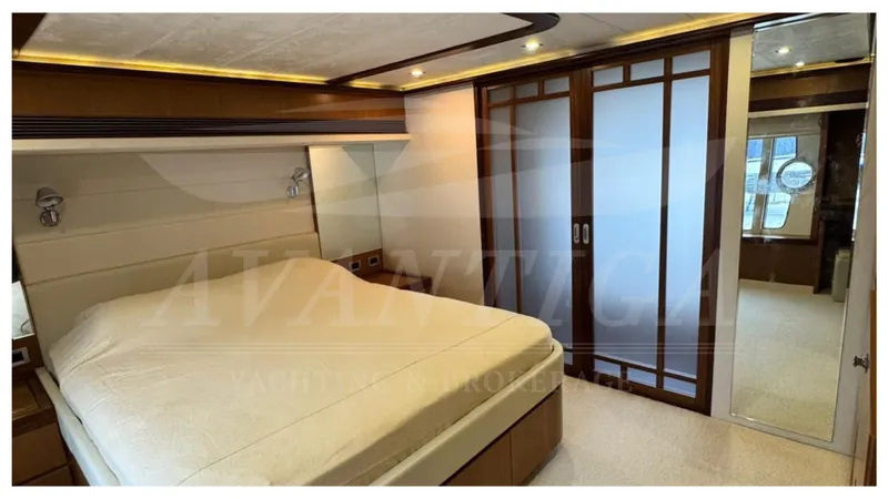  Yacht Photos Pics Luxurious bedroom interior of 2008 Ferretti Yachts 731 with modern design and elegant furnishings.