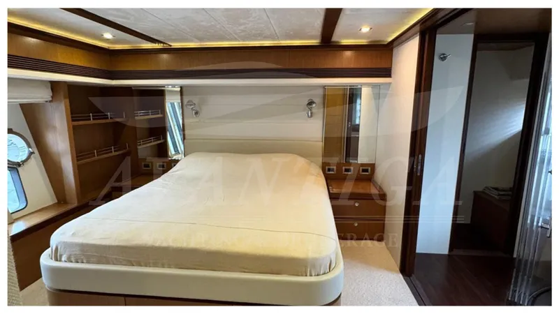  Yacht Photos Pics Luxurious bedroom interior of 2008 Ferretti Yachts 731, featuring elegant wood accents and modern design.