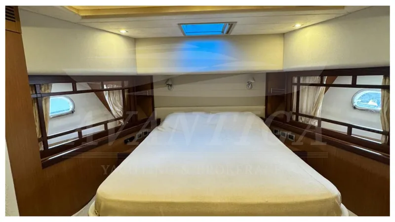  Yacht Photos Pics Luxurious bedroom interior of 2008 Ferretti Yachts 731 with elegant wood accents.