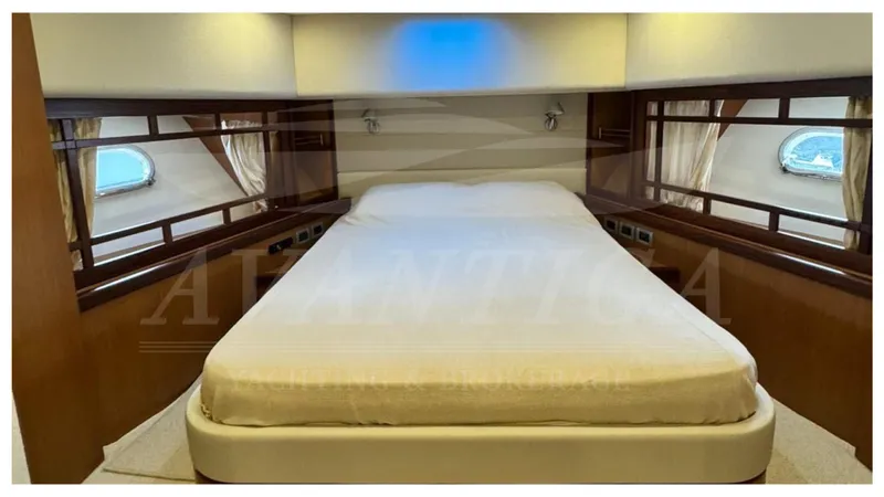  Yacht Photos Pics Luxurious bedroom interior of 2008 Ferretti Yachts 731 with elegant wood accents.