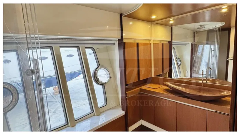  Yacht Photos Pics Luxurious bathroom interior of 2008 Ferretti Yachts 731 with modern fixtures and large windows.