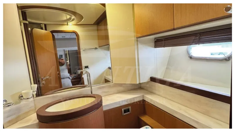  Yacht Photos Pics Luxurious bathroom interior of 2008 Ferretti Yachts 731 with modern fixtures and wooden accents.