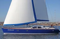 Motorsailer ВС-1800С 2007 sailing on calm waters with blue hull and white sails.