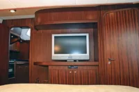 Luxurious interior of 2007 Motorsailer ВС-1800С with wood paneling and flat-screen TV.