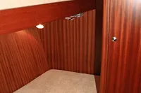 Interior of 2007 Motorsailer ВС-1800С with wooden bunk beds and warm lighting.