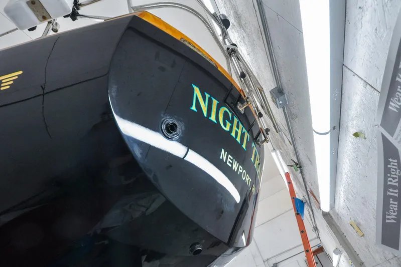 Night Train Yacht Photos Pics Hinckley Sou'wester 51 sailboat, 1986 model, in a workshop with "Night Train" name visible.